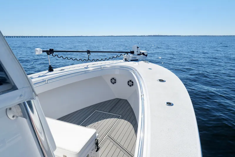 Slide: The Image of 2024 Onslow Bay 27 Offshore Edition boat on open water, showcasing sleek deck design. - 35
