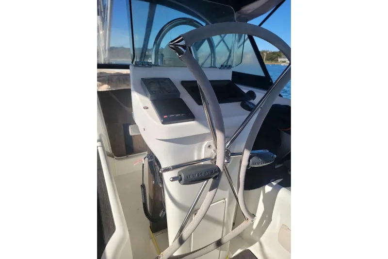 Slide: The Image of Steering wheel and controls of 2001 Beneteau Oceanis Clipper 36 CC sailboat. - 1