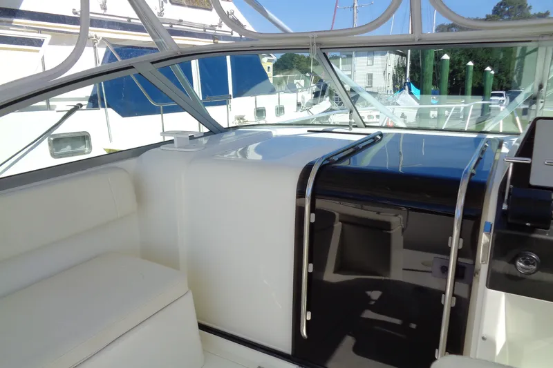 Slide: The Image of Interior view of a 1994 Bertram 30 Moppie boat, showcasing seating and helm area. - 24