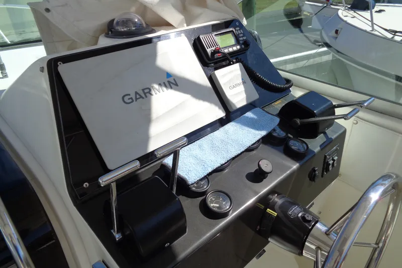 Slide: The Image of 1994 Bertram 30 Moppie helm with Garmin navigation system and control panel. - 25