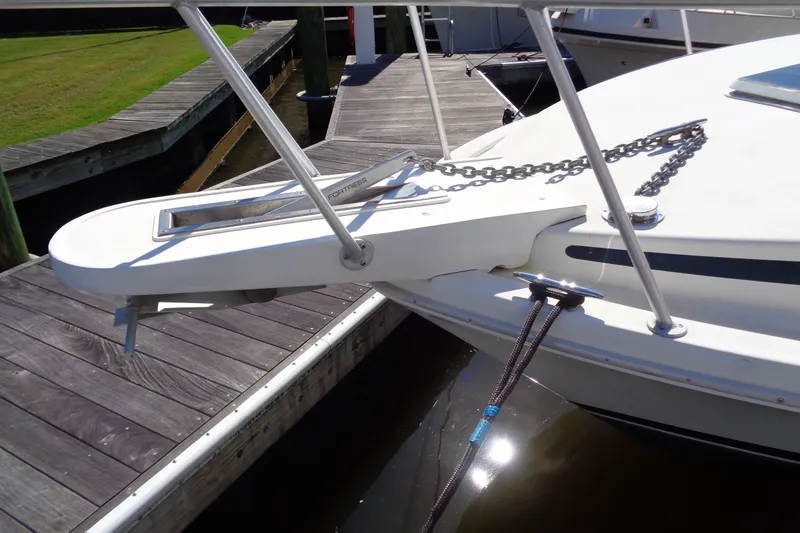 Slide: The Image of Bow of a 1994 Bertram 30 Moppie boat with anchor and chain at dock. - 4