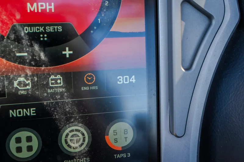 Slide: The Image of Close-up of 2018 Tigé RZX3 dashboard display showing engine hours and settings. - 34