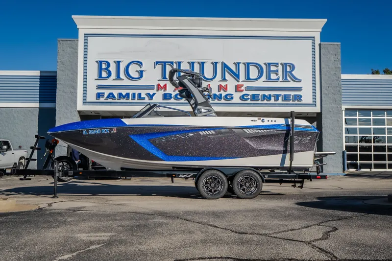 Slide: The Image of 2018 Tigé RZX3 boat on trailer at Big Thunder Marine dealership. - 55