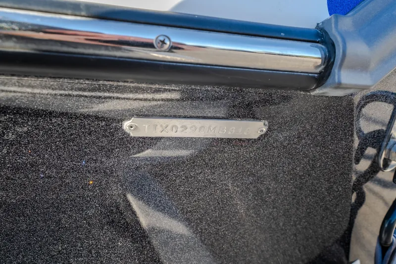 Slide: The Image of 2018 Tigé RZX3 boat hull identification number plate close-up. - 47