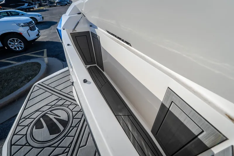 Slide: The Image of 2018 Tigé RZX3 boat interior detail with sleek storage compartment and stylish flooring design. - 30