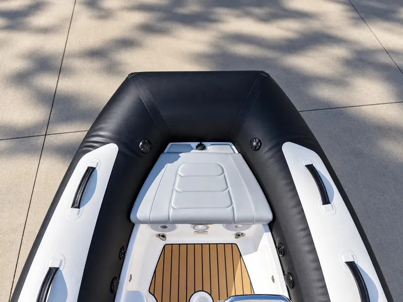 Slide: The Image of The image shows the deck of a 2026 Williams Jet Tenders Sportjet 345 with sleek upholstery. - 12