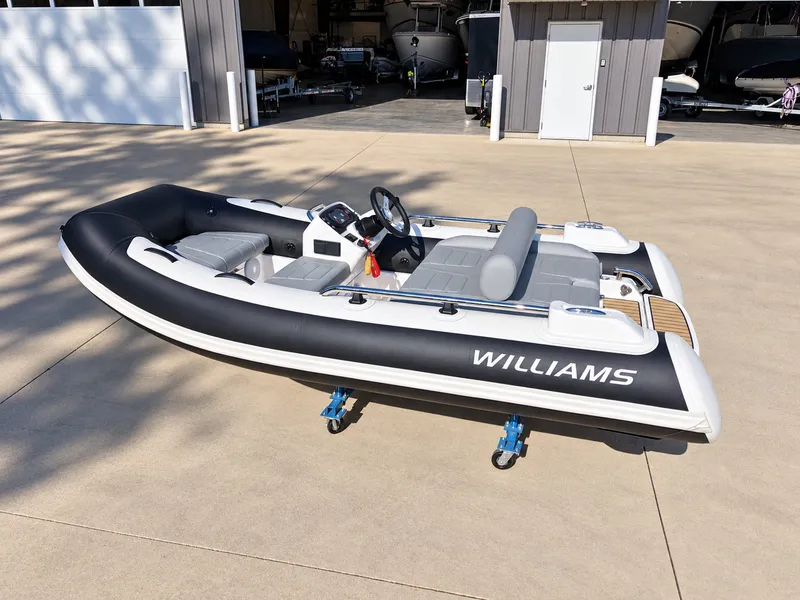 Slide: The Image of 2026 Williams Jet Tenders Sportjet 345 on a trailer in a yard. - 4