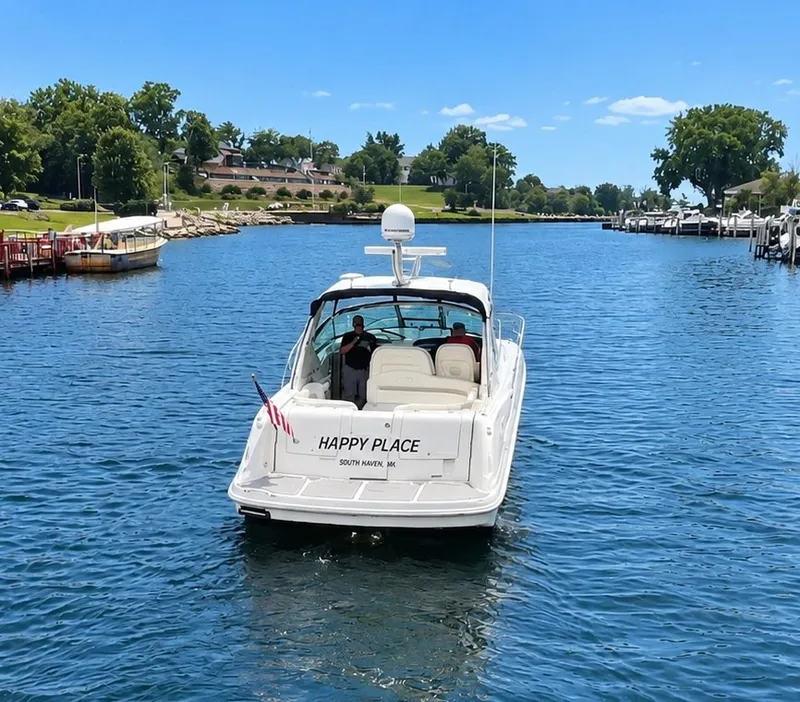 Slide: The Image of Sea Ray 390 Sundancer 2010 on calm water with two people on board. - 4