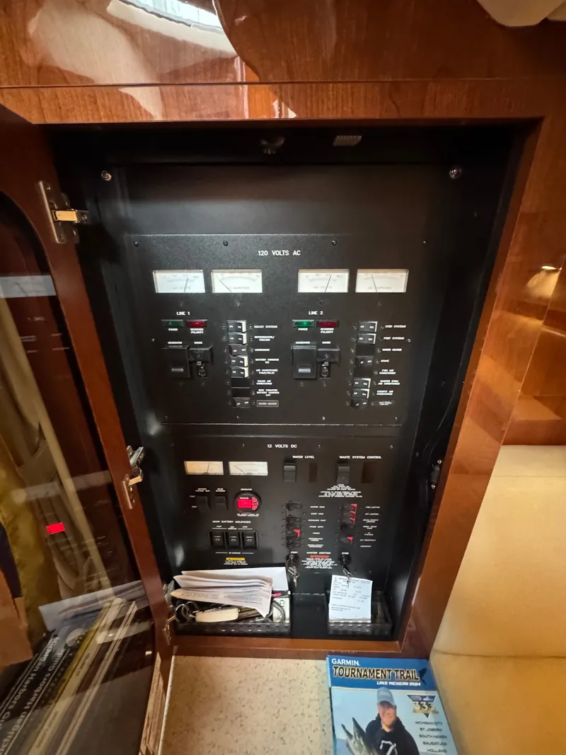 Slide: The Image of Electrical control panel inside a 2010 Sea Ray 390 Sundancer. - 35