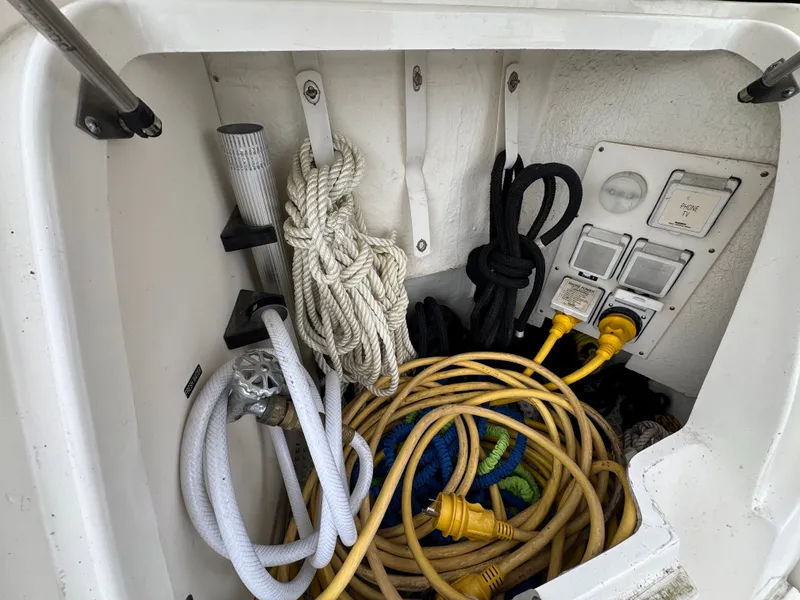 Slide: The Image of Storage compartment with ropes and cables on a 2010 Sea Ray 390 Sundancer. - 41