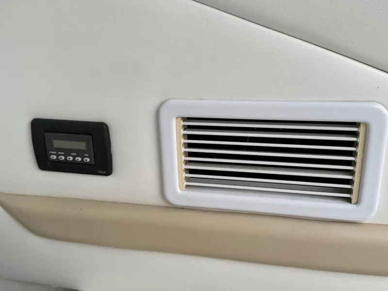 Slide: The Image of A vent and control panel are integrated into the interior wall of a boat. - 22