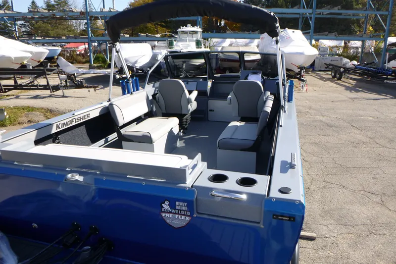 Slide: The Image of Interior view of a 2027 KingFisher 2025 Escape boat, showcasing seating and storage. - 9