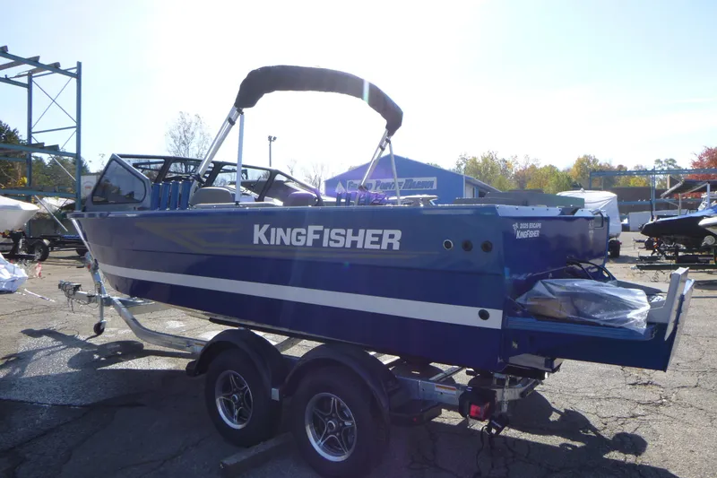 Slide: The Image of Blue 2027 KingFisher 2025 Escape boat on trailer, outdoor display. - 4