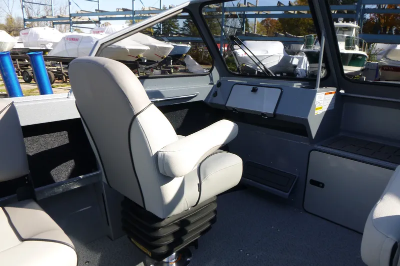 Slide: The Image of Interior of 2027 KingFisher 2025 Escape boat with comfortable seating and modern dashboard. - 13