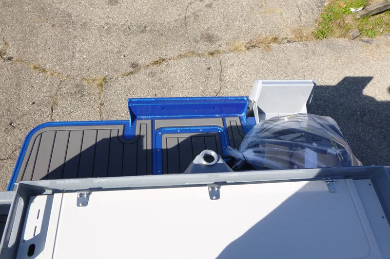 Slide: The Image of Rear deck view of a 2027 KingFisher 2025 Escape boat, showcasing storage and seating. - 24