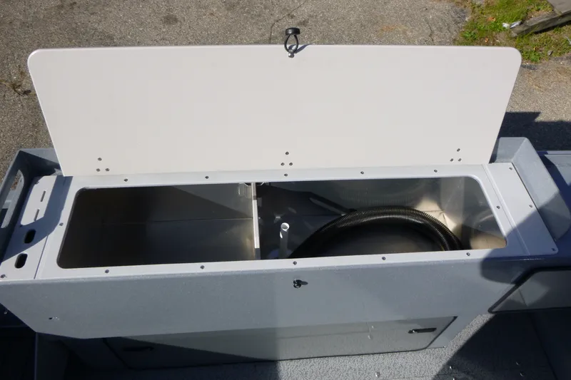 Slide: The Image of Open storage compartment on 2027 KingFisher 2025 Escape boat, showing interior space. - 23