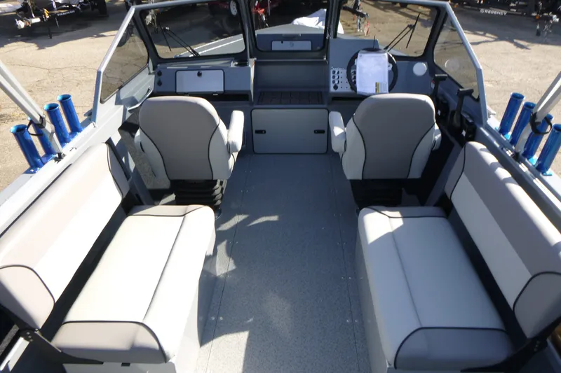 Slide: The Image of Interior of 2027 KingFisher 2025 Escape boat with seating and rod holders. - 11