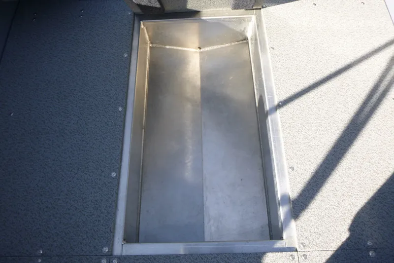 Slide: The Image of Storage compartment on KingFisher 2025 Escape boat, 2027 model, with textured flooring. - 21