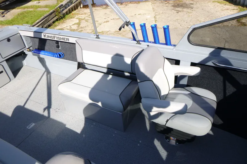 Slide: The Image of Interior of 2027 KingFisher 2025 Escape boat with seating and storage compartments. - 18