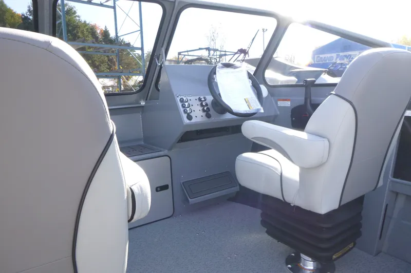Slide: The Image of Interior of 2027 KingFisher 2025 Escape boat with modern helm and seating. - 12