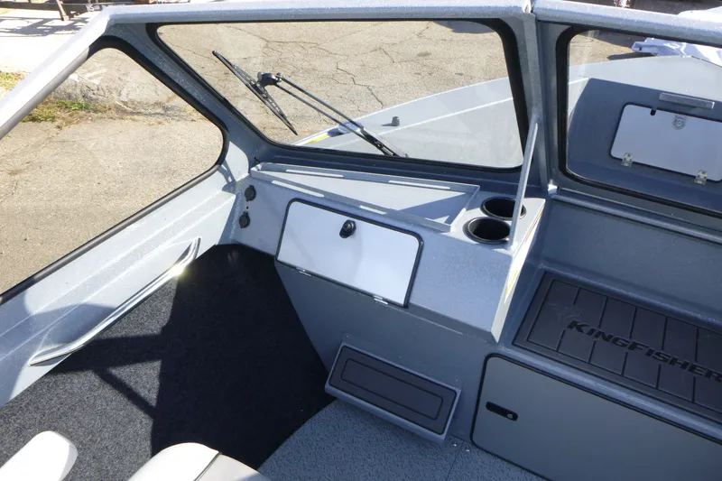 Slide: The Image of Interior view of 2027 KingFisher 2025 Escape boat, featuring dashboard and seating area. - 15