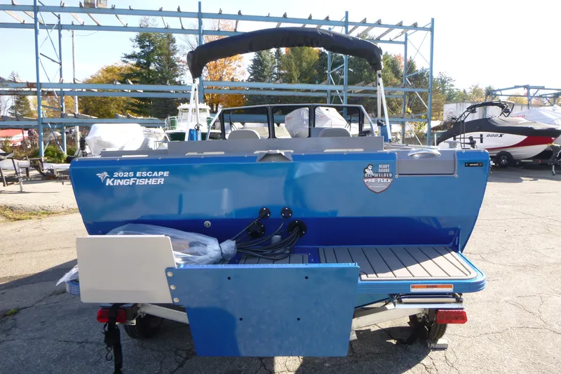 Slide: The Image of Blue 2027 KingFisher 2025 Escape boat, rear view, parked outdoors. - 3