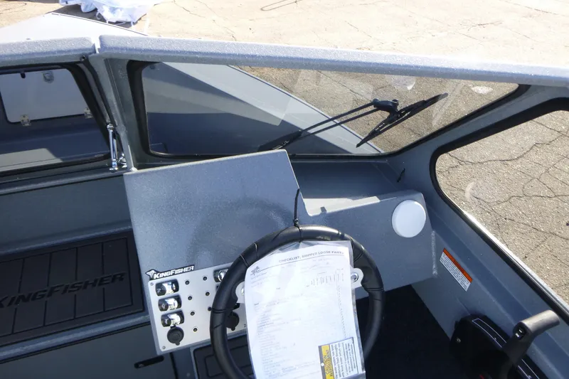Slide: The Image of Interior view of 2027 KingFisher 2025 Escape boat dashboard and steering wheel. - 14