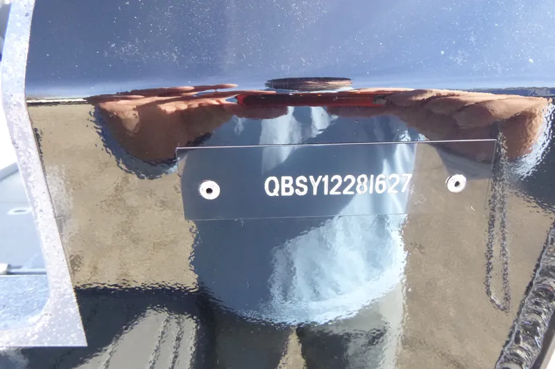 Slide: The Image of Close-up of KingFisher 2025 Escape HT boat hull with serial number QBSY1228I627. - 30