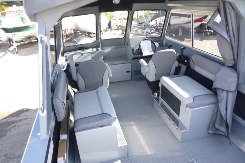 Slide: The Image of Interior of 2027 KingFisher 2025 Escape HT boat, featuring modern seating and spacious layout. - 29