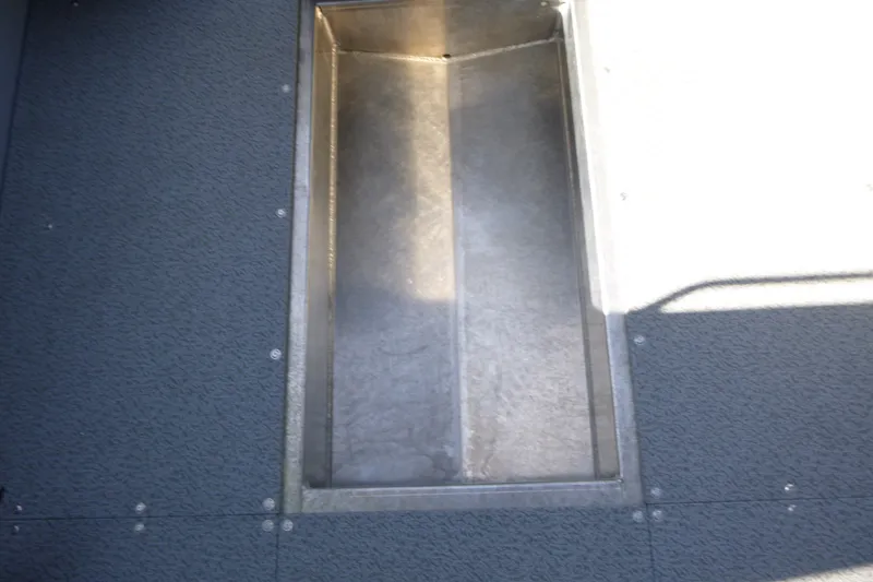 Slide: The Image of Interior view of KingFisher 2025 Escape HT boat, showcasing a storage compartment, 2027 model. - 25