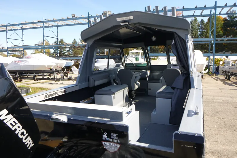 Slide: The Image of KingFisher 2025 Escape HT boat, 2027 model, with spacious interior and Mercury engine. - 10
