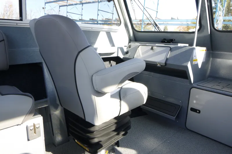 Slide: The Image of Interior of 2027 KingFisher 2025 Escape HT boat, featuring a modern captain's chair. - 14