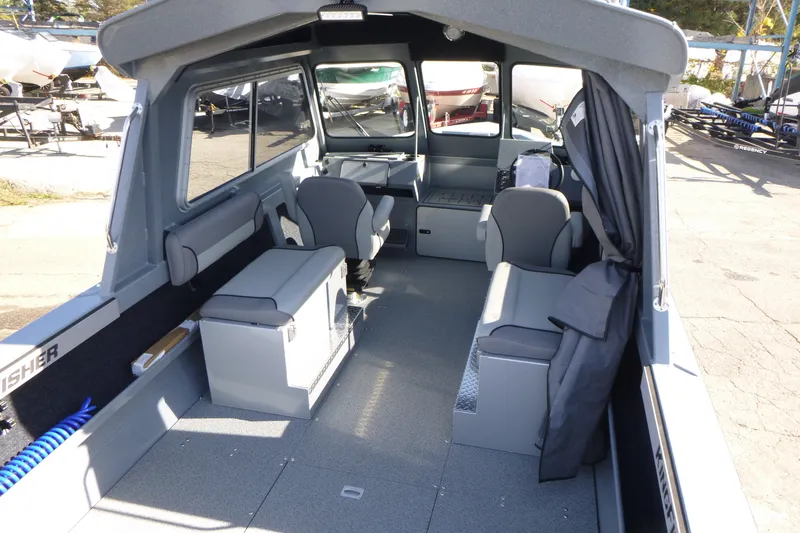 Slide: The Image of Interior of 2027 KingFisher 2025 Escape HT boat, featuring seating and storage. - 11