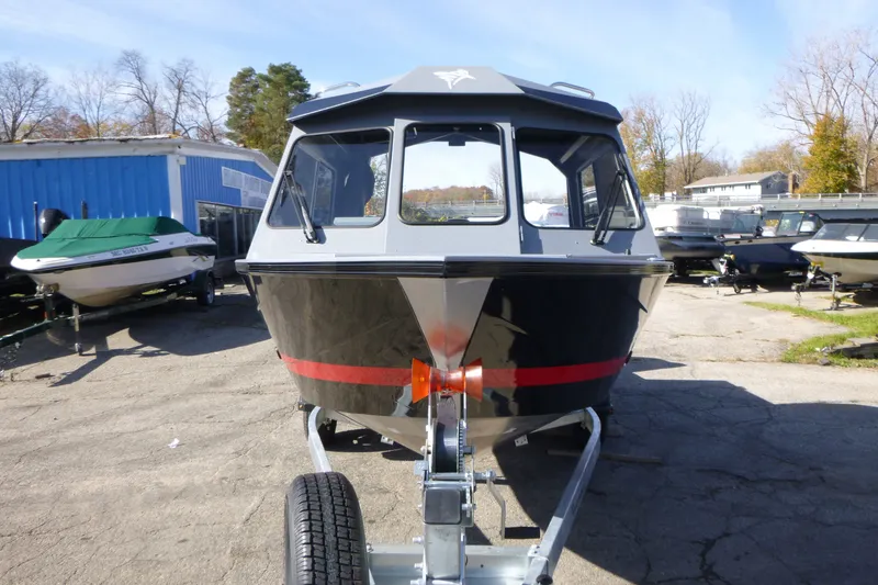 Slide: The Image of Front view of a 2027 KingFisher 2025 Escape HT boat on a trailer. - 8
