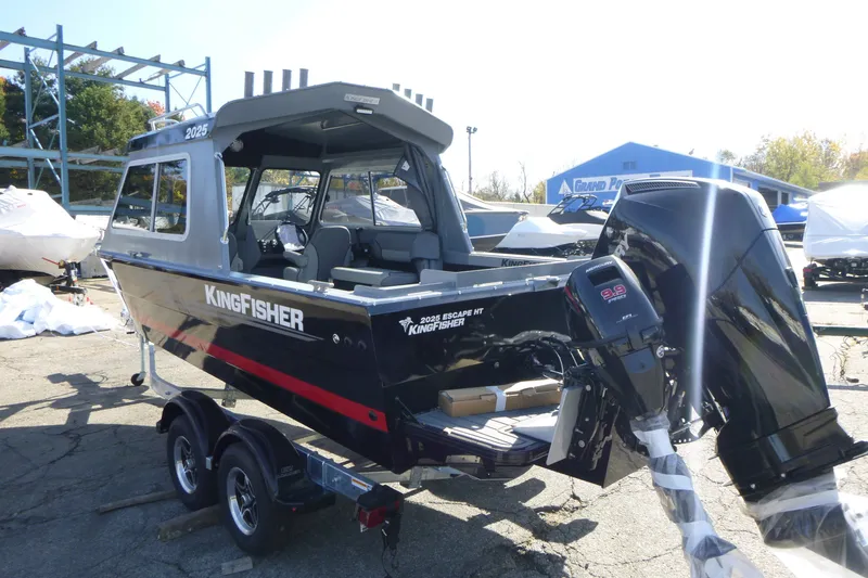 Slide: The Image of KingFisher 2025 Escape HT boat on trailer, featuring powerful outboard motor, 2027 model. - 5