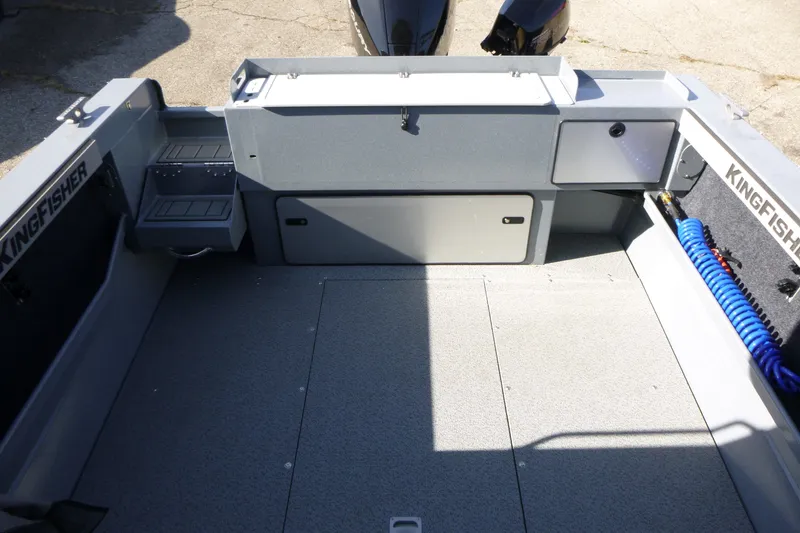 Slide: The Image of Interior of 2027 KingFisher 2025 Escape HT boat, featuring storage compartments and clean deck. - 24