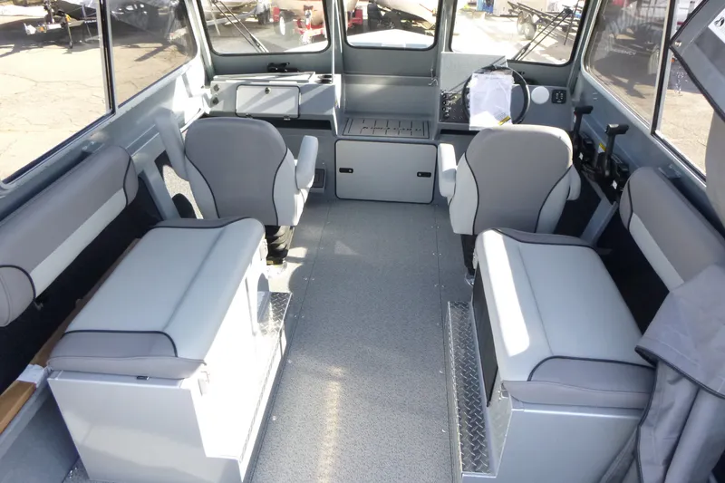 Slide: The Image of Interior of 2027 KingFisher 2025 Escape HT boat with modern seating and controls. - 23