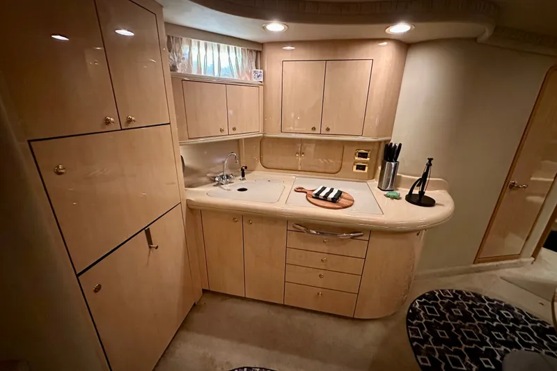 Slide: The Image of Luxurious kitchen interior of 2001 Sea Ray Sundancer 460 yacht with modern amenities. - 20