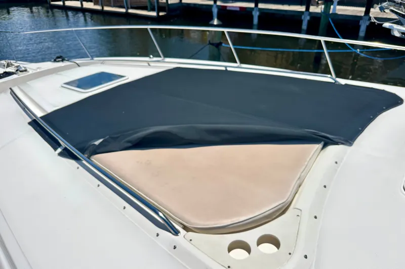 Slide: The Image of Bow area of 2001 Sea Ray Sundancer 460 with sunpad and cover. - 31