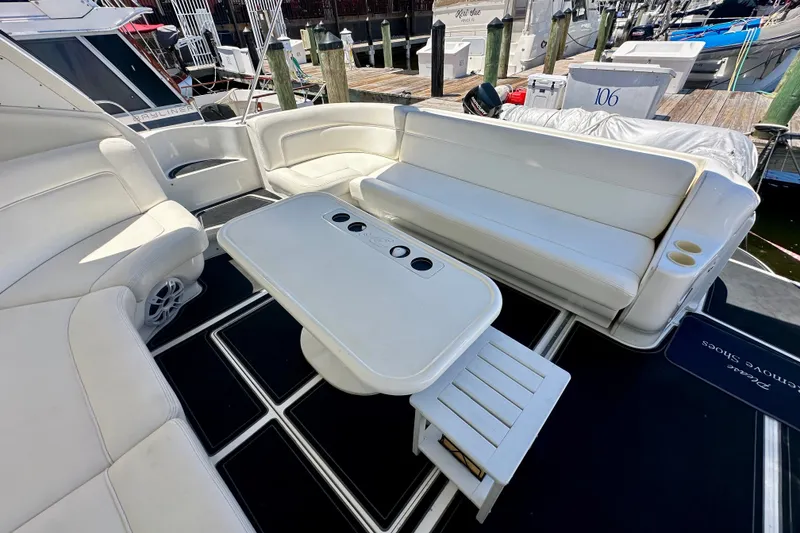 Slide: The Image of Luxurious 2001 Sea Ray Sundancer 460 yacht interior with white seating and table. - 11