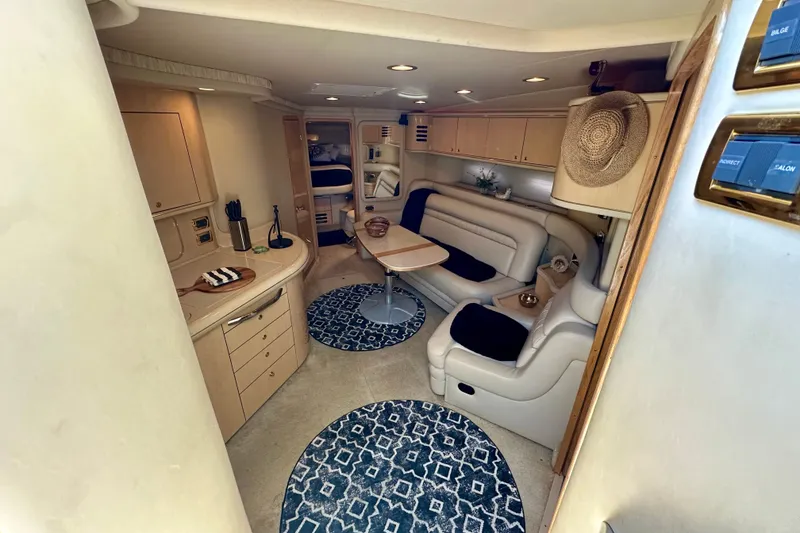 Slide: The Image of Interior of 2001 Sea Ray Sundancer 460 yacht with elegant seating and modern amenities. - 1