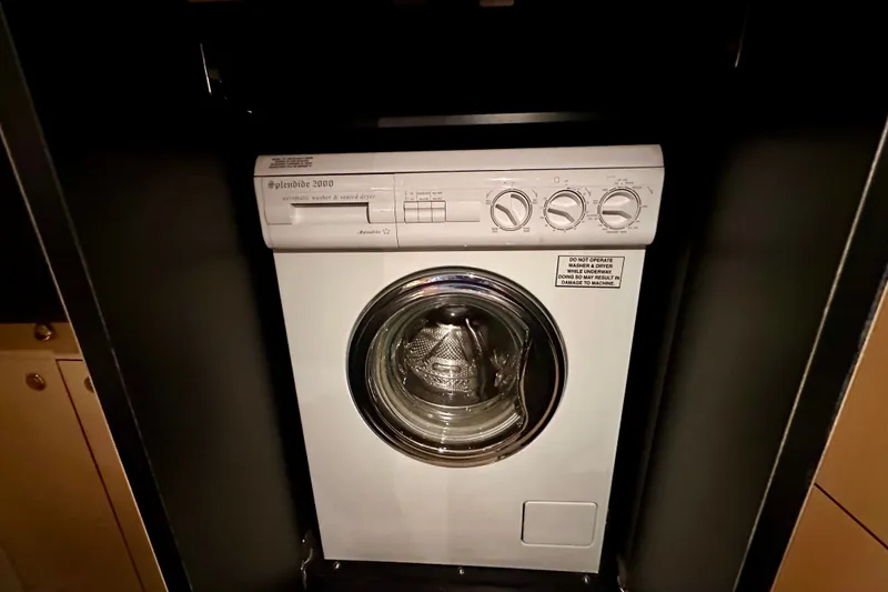 Slide: The Image of Splendide 2000 washer-dryer in 2001 Sea Ray Sundancer 460 yacht interior. - 28