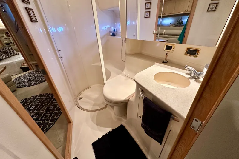 Slide: The Image of Luxurious bathroom interior of 2001 Sea Ray Sundancer 460 yacht, featuring modern amenities. - 33