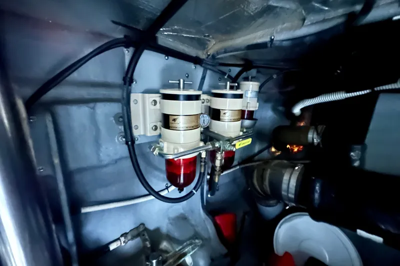 Slide: The Image of Engine room of 2001 Sea Ray Sundancer 460 with fuel filters and hoses. - 36