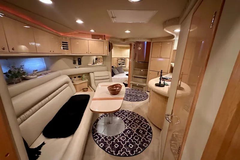 Slide: The Image of Luxurious interior of a 2001 Sea Ray Sundancer 460 yacht with elegant seating and modern amenities. - 24