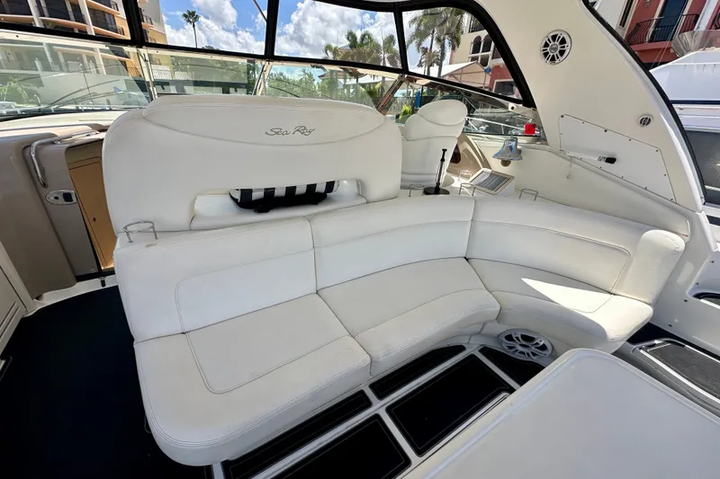 Slide: The Image of Luxurious 2001 Sea Ray Sundancer 460 yacht interior with white seating and modern design. - 10