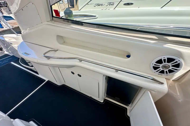 Slide: The Image of Interior view of 2001 Sea Ray Sundancer 460 yacht with storage and speaker. - 12