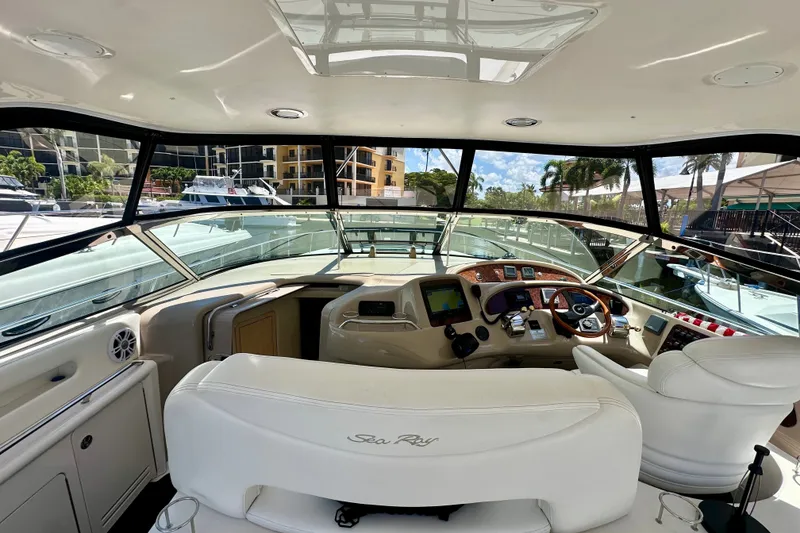 Slide: The Image of Interior view of 2001 Sea Ray Sundancer 460 yacht cockpit with modern controls and seating. - 15