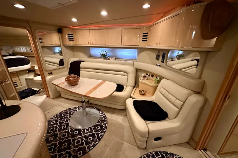 Slide: The Image of Luxurious interior of 2001 Sea Ray Sundancer 460 yacht with plush seating and elegant decor. - 21