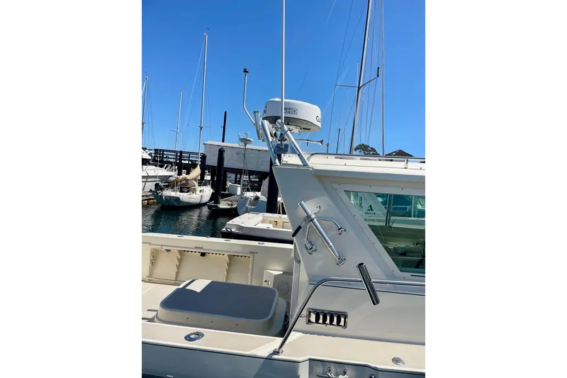 Slide: The Image of 2001 Albin 28 Tournament Express docked at marina with clear blue sky. - 17
